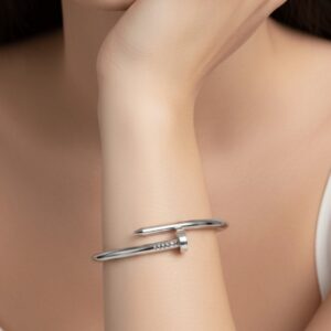 Silver nail bracelet, classic design on a white background.